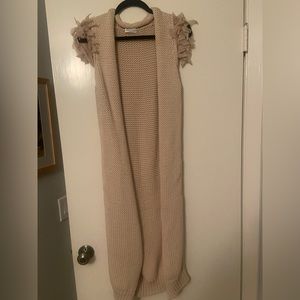 Blush pink Brunello Cucinelli sweater vest with ruffled sleeves. Worn once